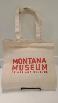 canvas cotton tote bag with Montana Museum of Art and Culture screen printed in red on it