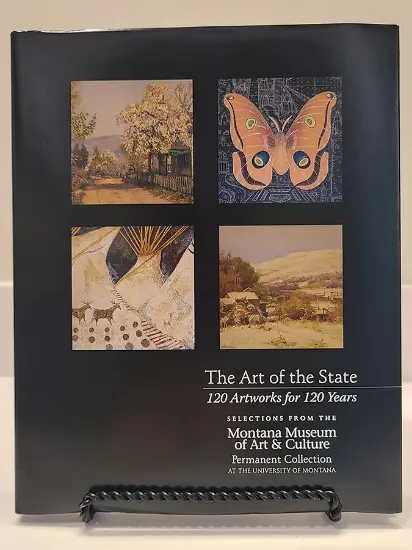 the art of the state book resting on a book stand, cover features four landscape and illustration artwork with text 120 artworks for 120 years under the title