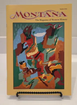 Montana magazine resting on a bookstand featuring a colorful illustration on the cover