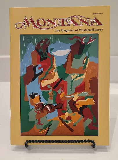 Montana magazine resting on a bookstand featuring a colorful illustration on the cover