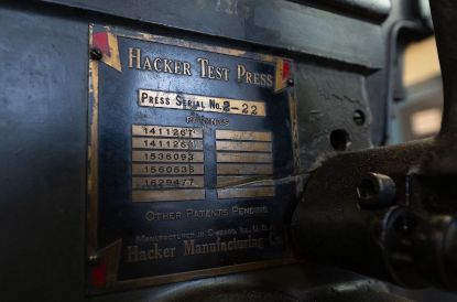 metal plate on the side of printing press reading hacker test press patent numbers and other information